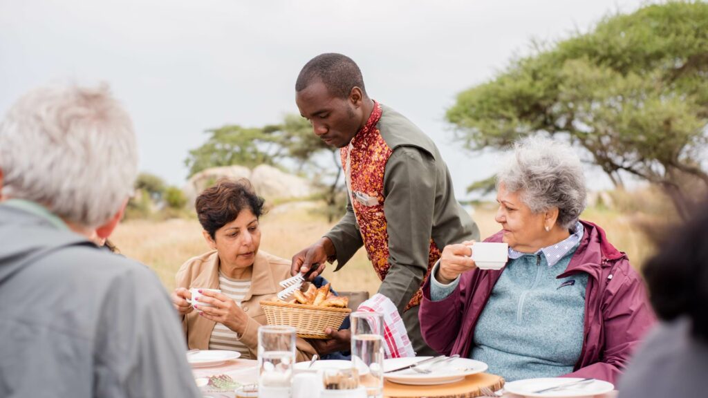 Chef serving Bush breakfast clients
