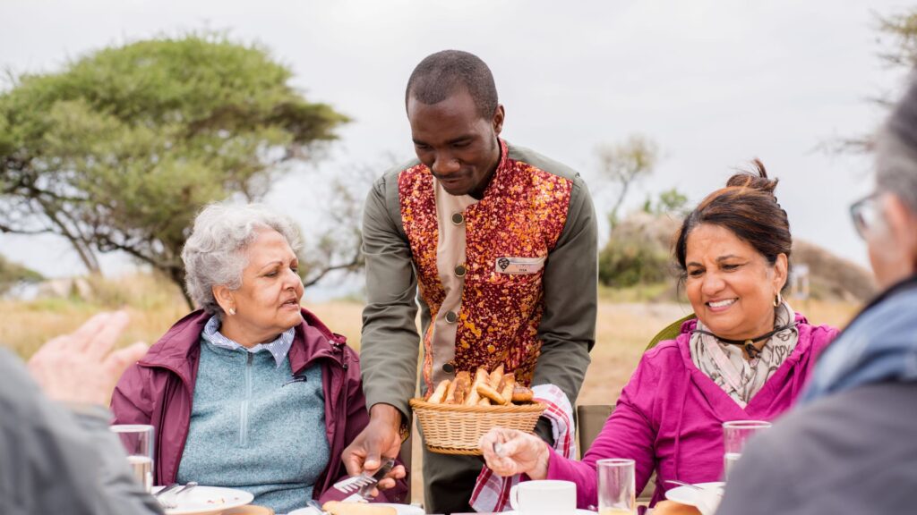 Chef serving during Bush Breakfast experience